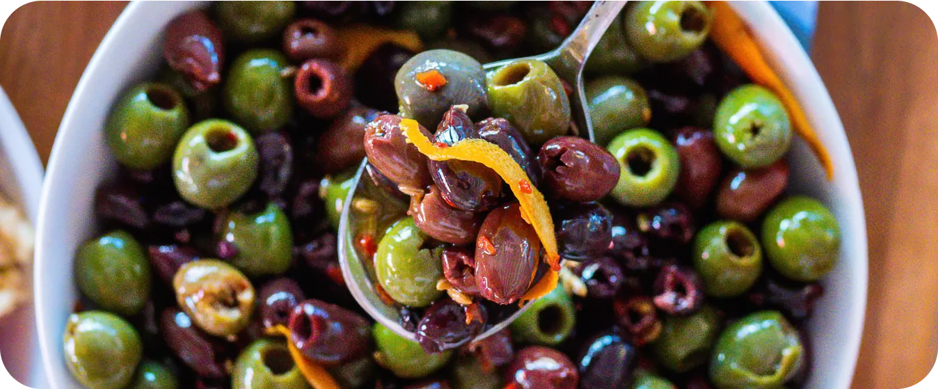 Overhead shot of a bowl of marinated olives, part of Uncle Nicky's happy hour.